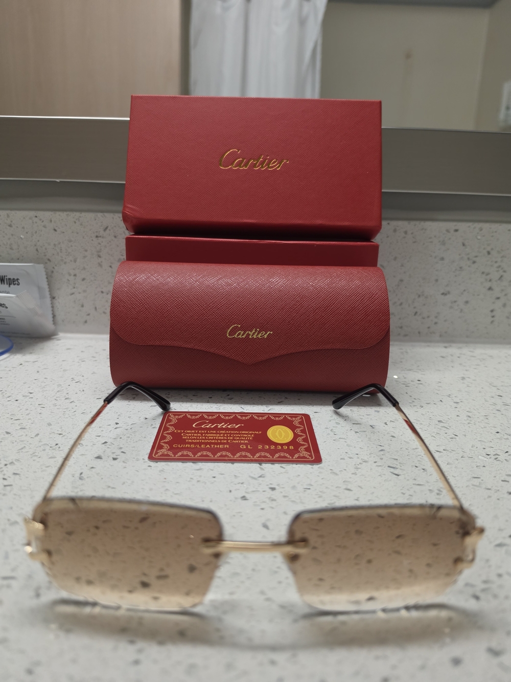 Cartier Rimless Sunglasses with Gold Accents and Red Case